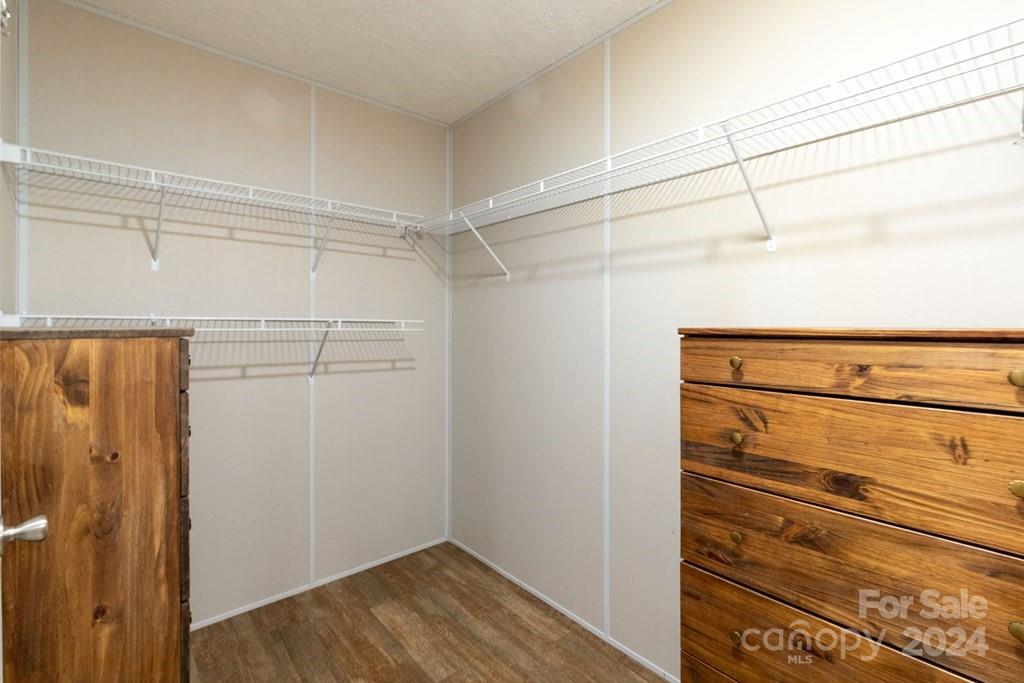 572 Dark Ridge Road Sylva, NC 28779 - Photo 19 of 26 a view of walk in closet with empty racks