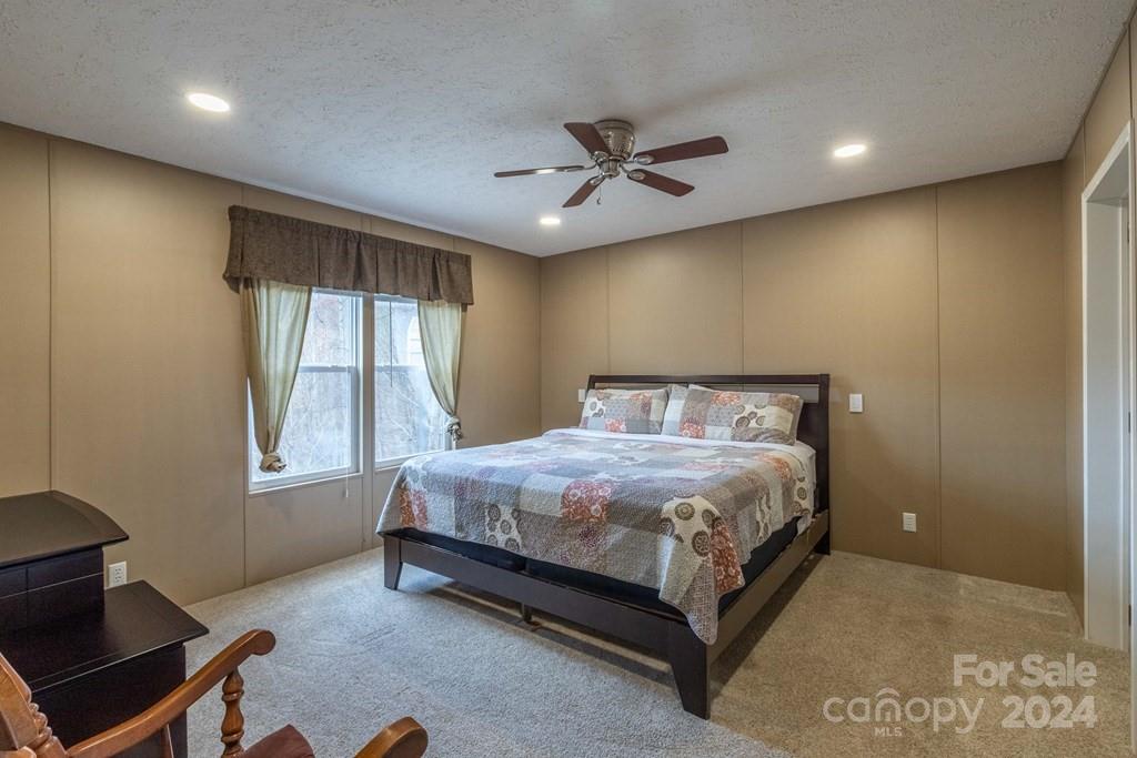 572 Dark Ridge Road Sylva, NC 28779 - Photo 22 of 26 a bedroom with a bed and window