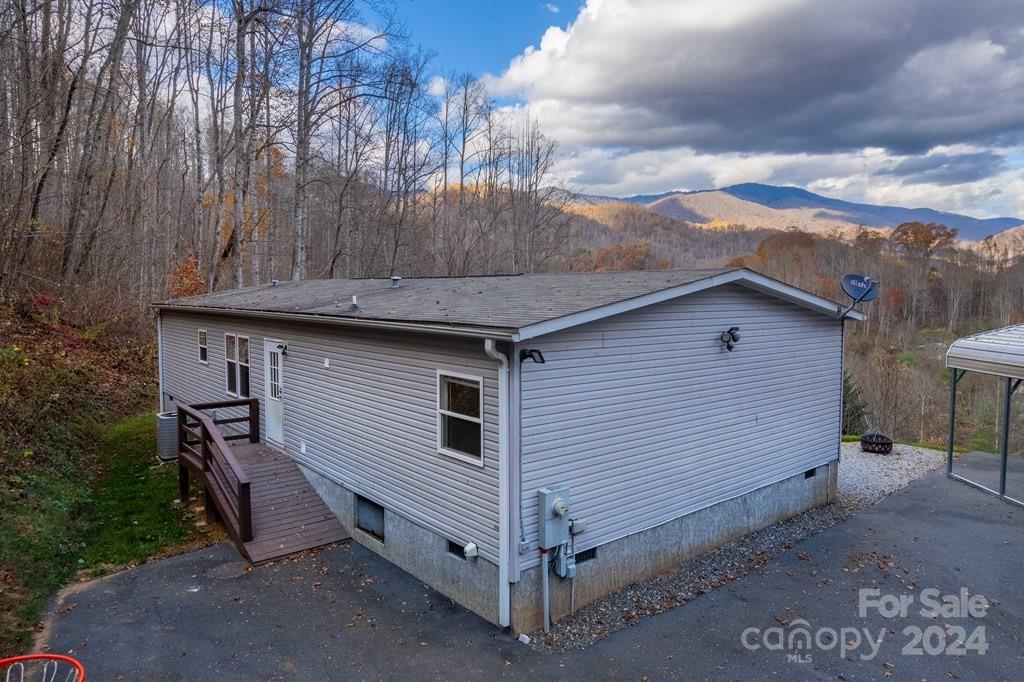 572 Dark Ridge Road Sylva, NC 28779 - Photo 7 of 26 a view of a house with a yard and wooden fence