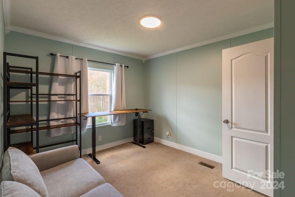 572 Dark Ridge Road Sylva, NC 28779 - Photo 10 of 26 a room with furniture and a window