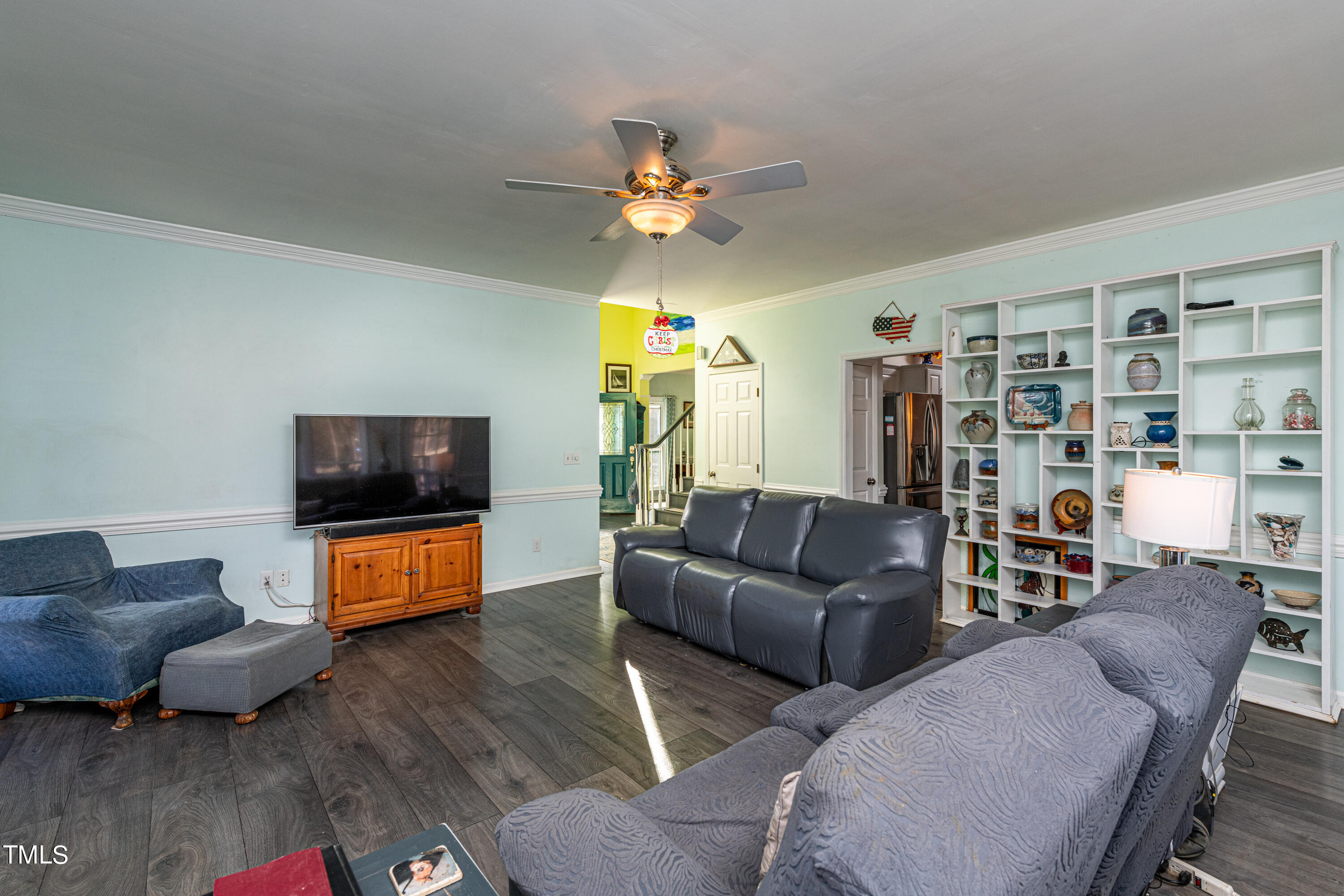 3105 Twatchman Drive Raleigh, NC 27616 - Photo 15 of 38 a living room with furniture and a flat screen tv