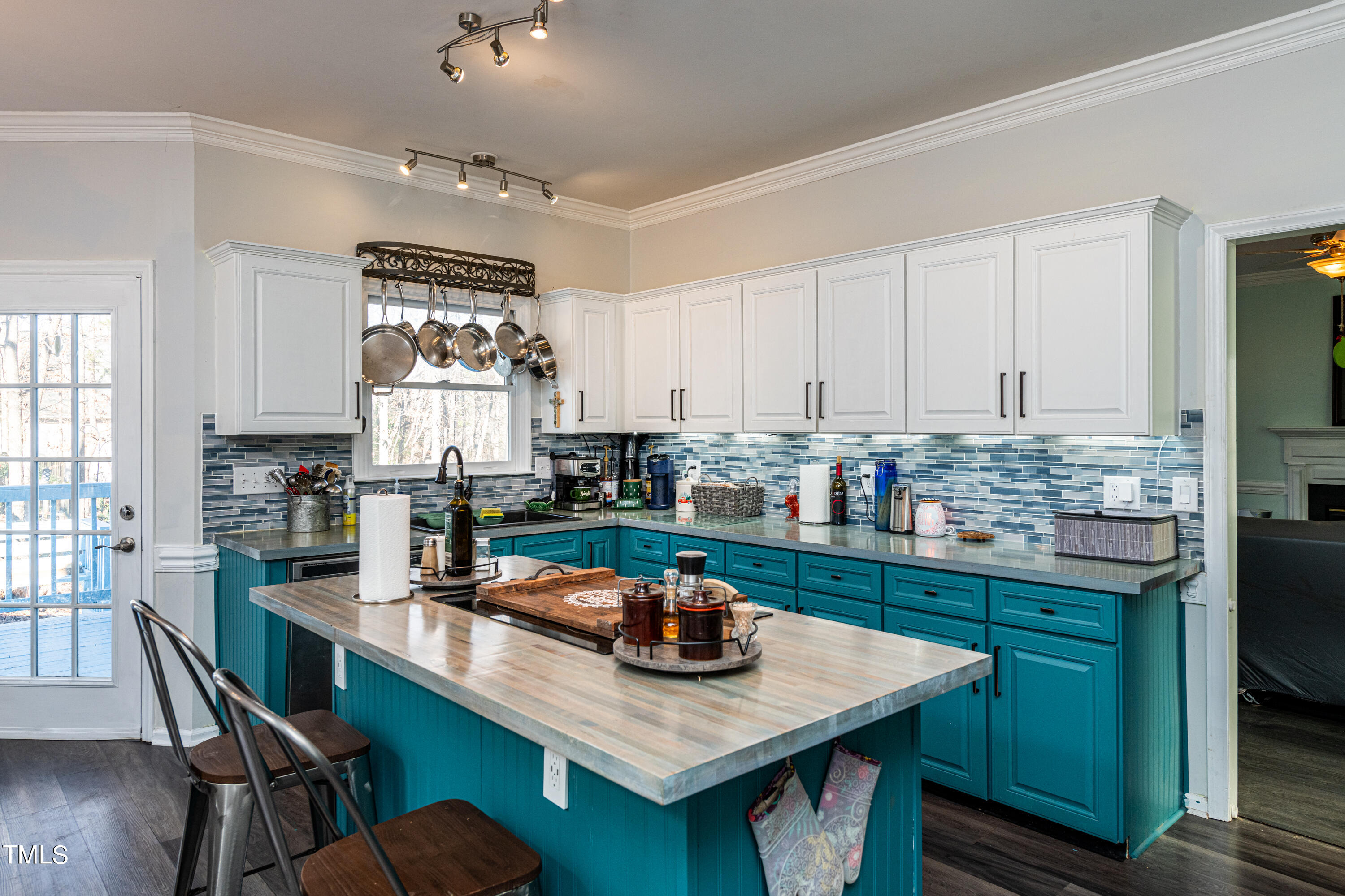3105 Twatchman Drive Raleigh, NC 27616 - Photo 16 of 38 a kitchen with granite countertop a table chairs stove and cabinets