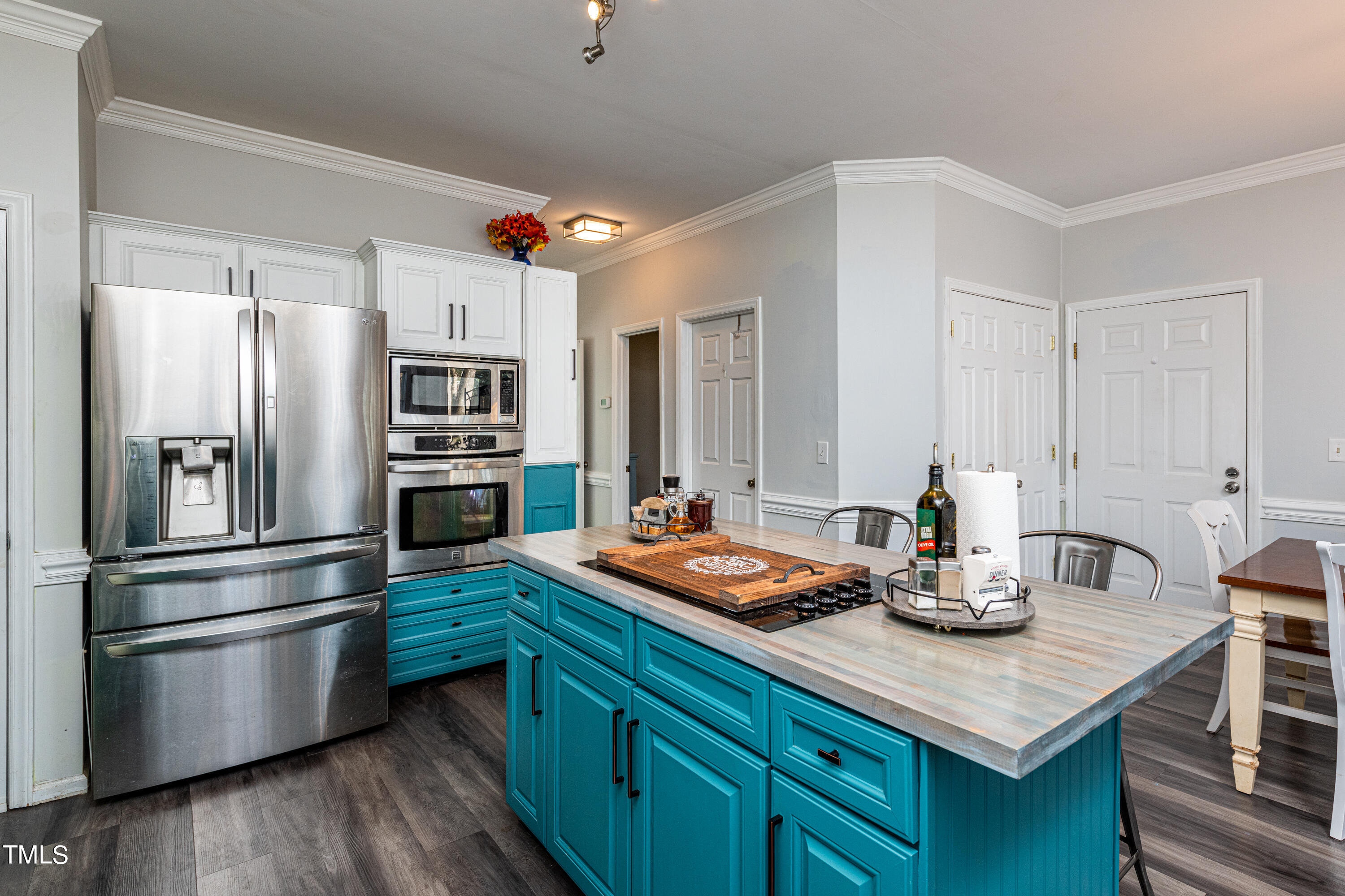 3105 Twatchman Drive Raleigh, NC 27616 - Photo 19 of 38 a kitchen with a refrigerator and a stove top oven