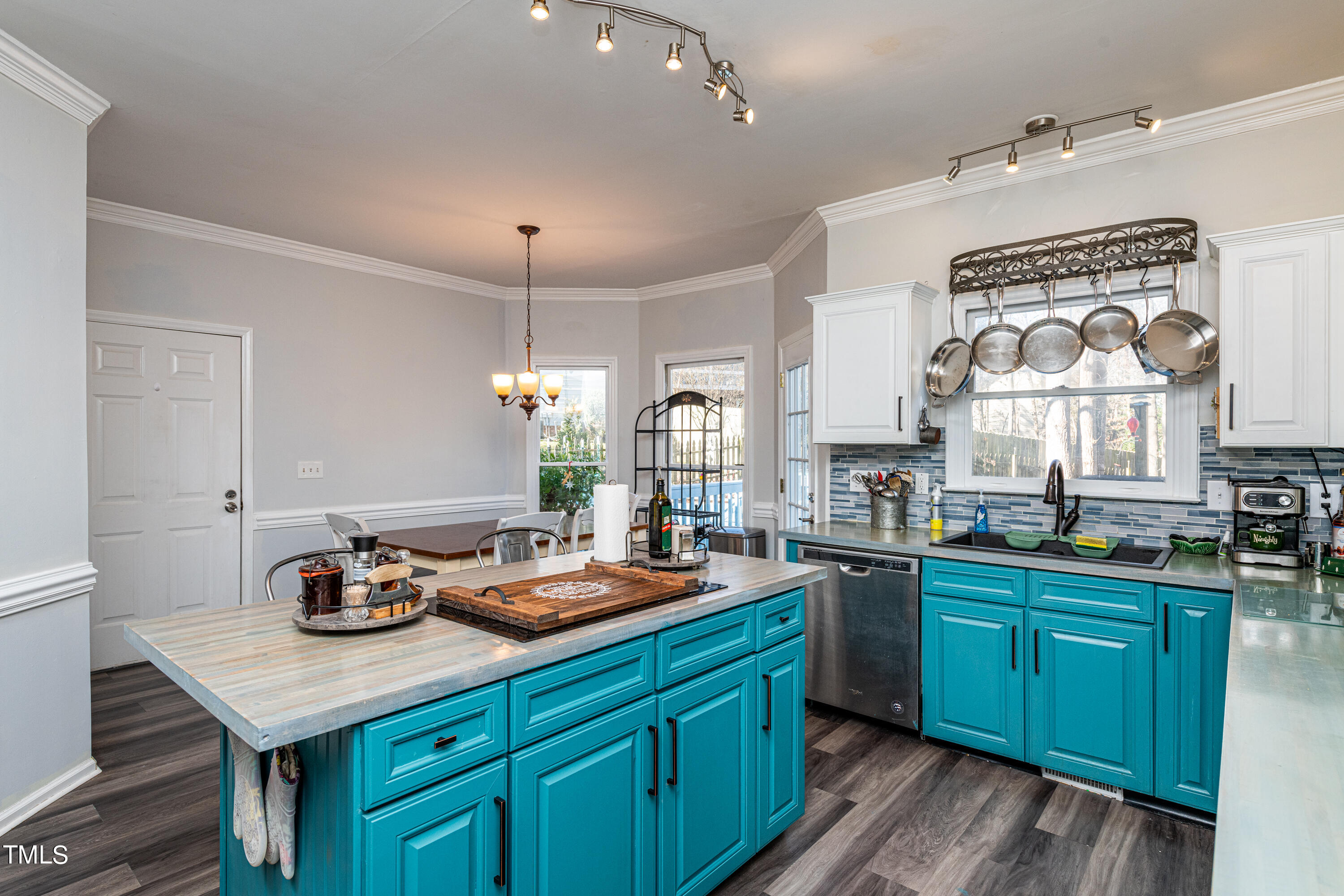 3105 Twatchman Drive Raleigh, NC 27616 - Photo 20 of 38 a kitchen with a sink stove and cabinets