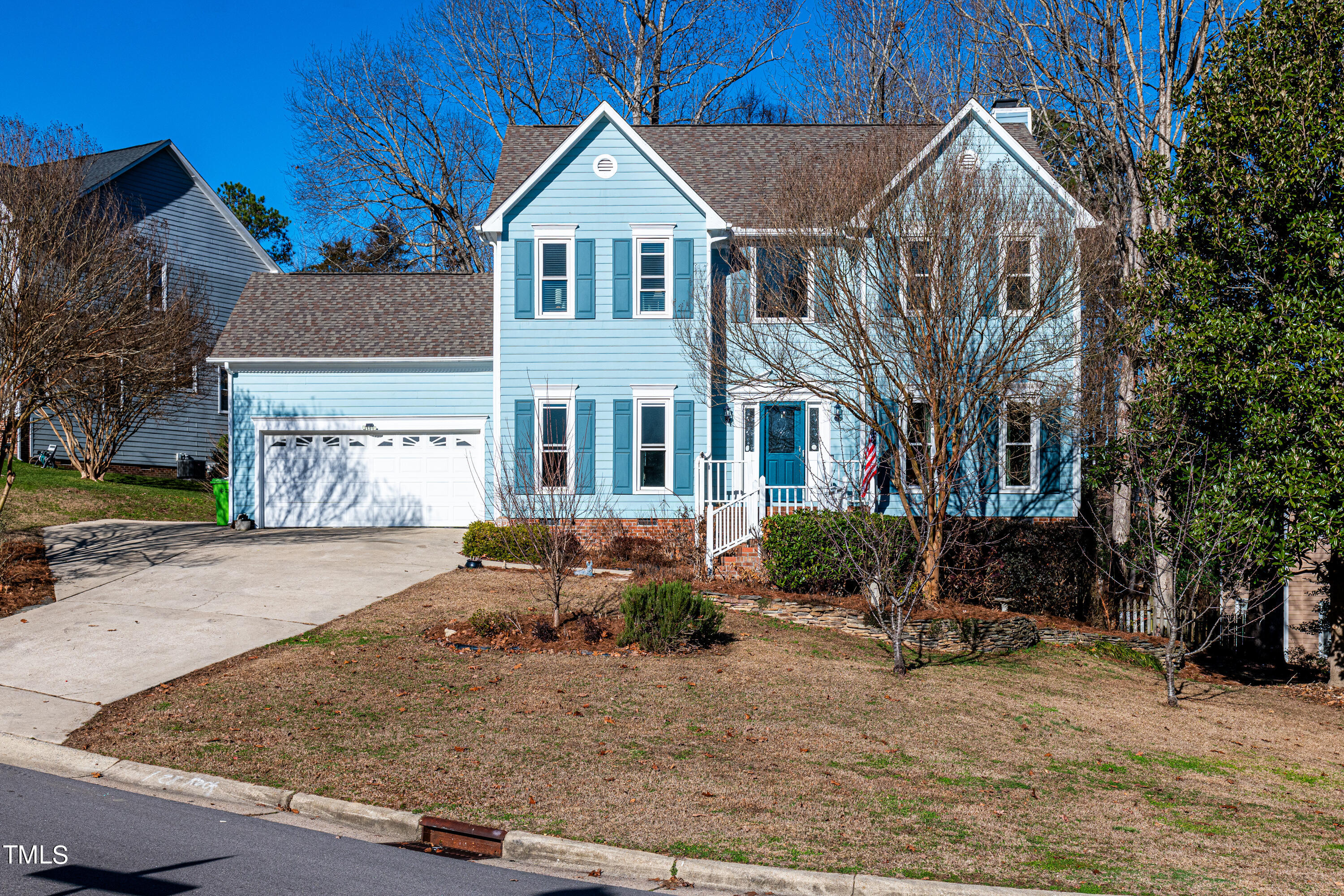 3105 Twatchman Drive Raleigh, NC 27616 - Photo 2 of 38 a front view of a house with garden