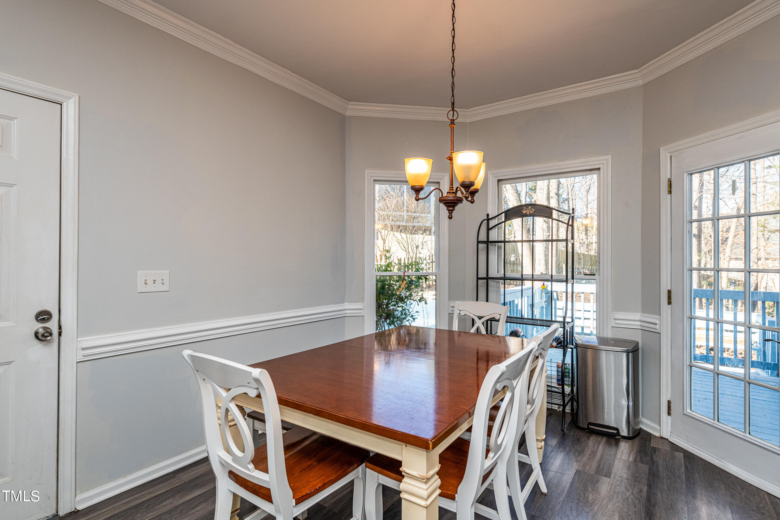 3105 Twatchman Drive Raleigh, NC 27616 - Photo 22 of 38 a view of a dining room with furniture window and wooden floor
