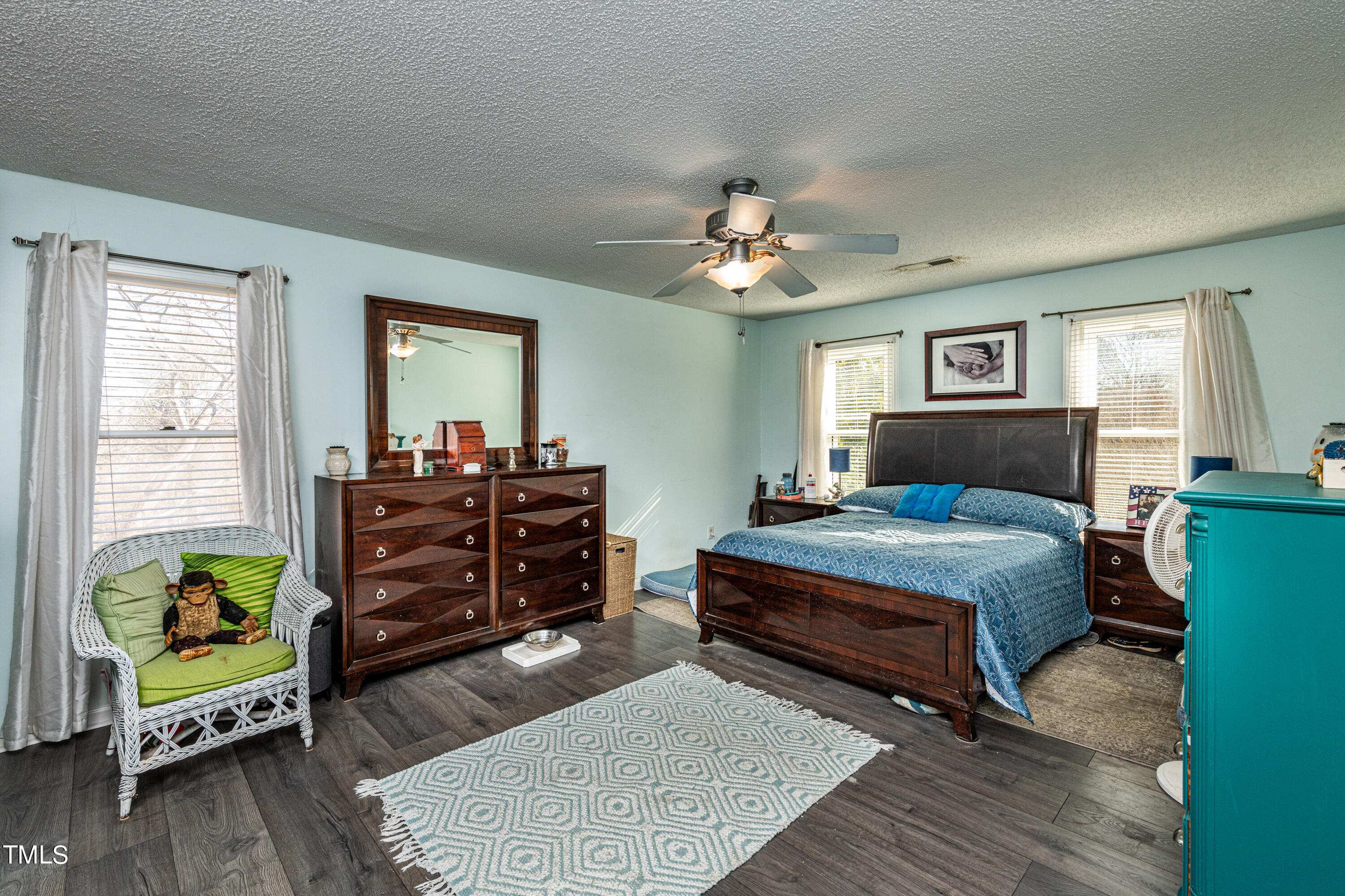 3105 Twatchman Drive Raleigh, NC 27616 - Photo 24 of 38 a bedroom with a bed and a dresser
