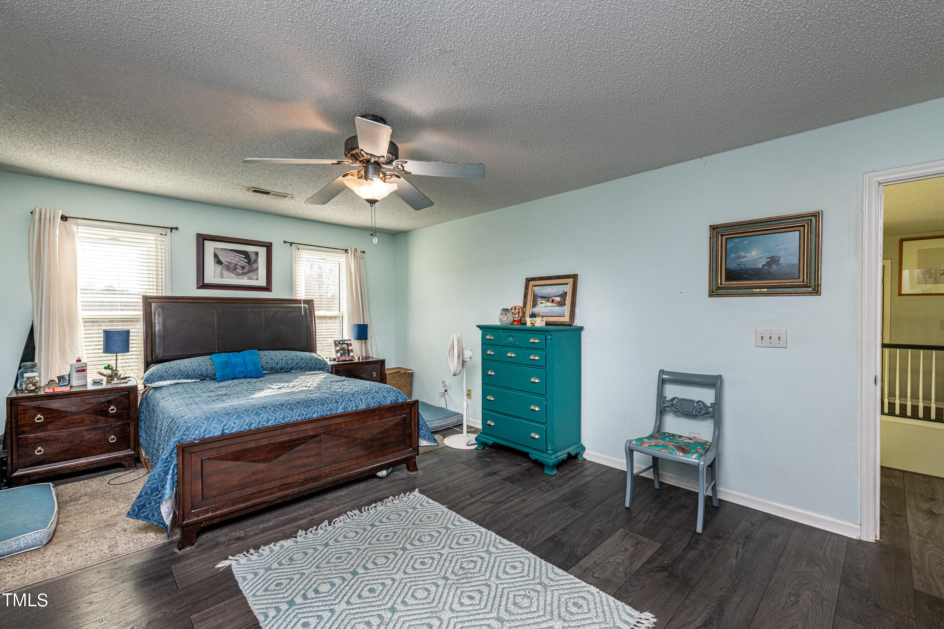 3105 Twatchman Drive Raleigh, NC 27616 - Photo 25 of 38 a bedroom with a bed and a table in it