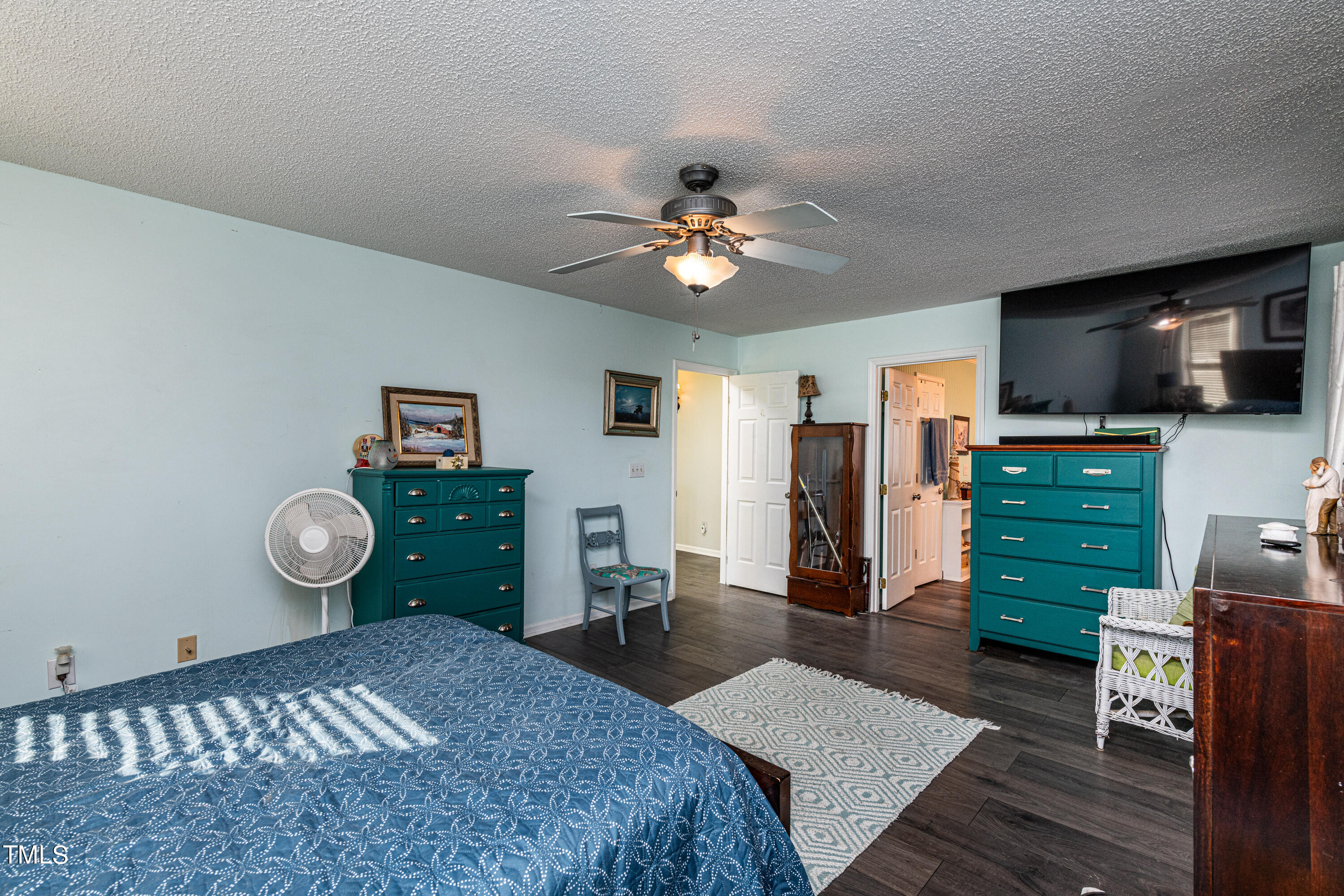 3105 Twatchman Drive Raleigh, NC 27616 - Photo 26 of 38 a bedroom with a bed and a flat screen tv