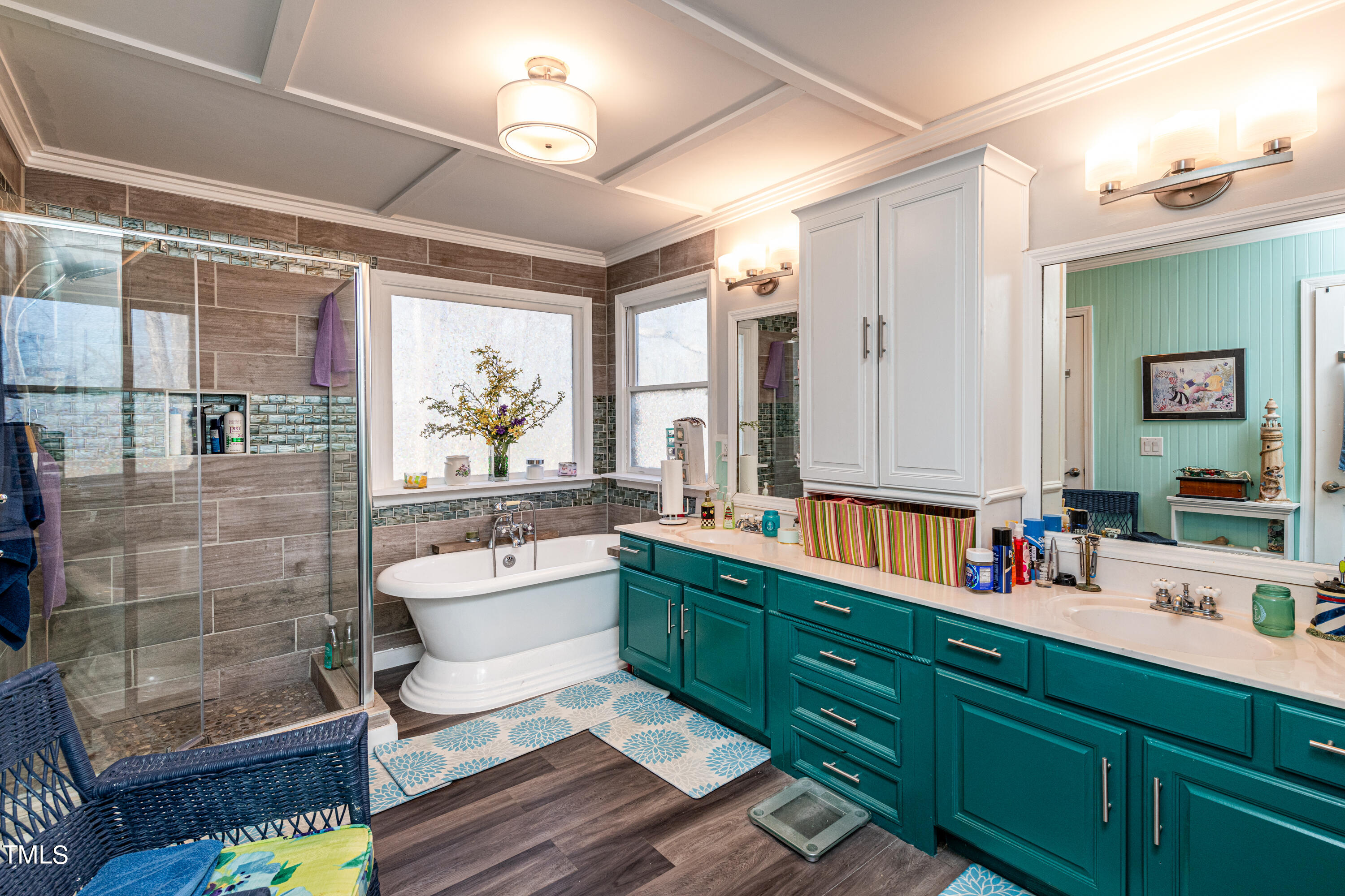 3105 Twatchman Drive Raleigh, NC 27616 - Photo 27 of 38 a bathroom with a double vanity sink toilet mirror and shower