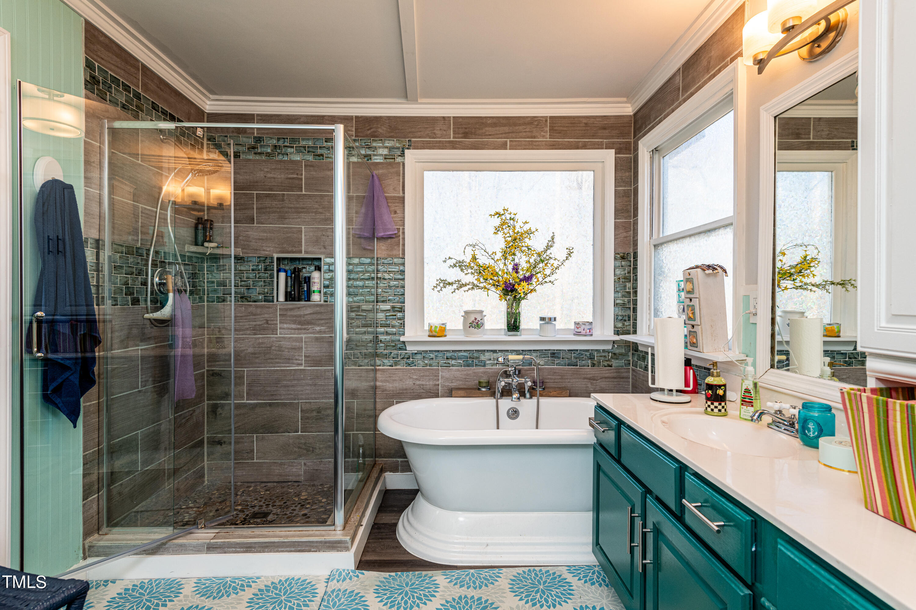 3105 Twatchman Drive Raleigh, NC 27616 - Photo 28 of 38 a bathroom with a sink a toilet a shower and a window