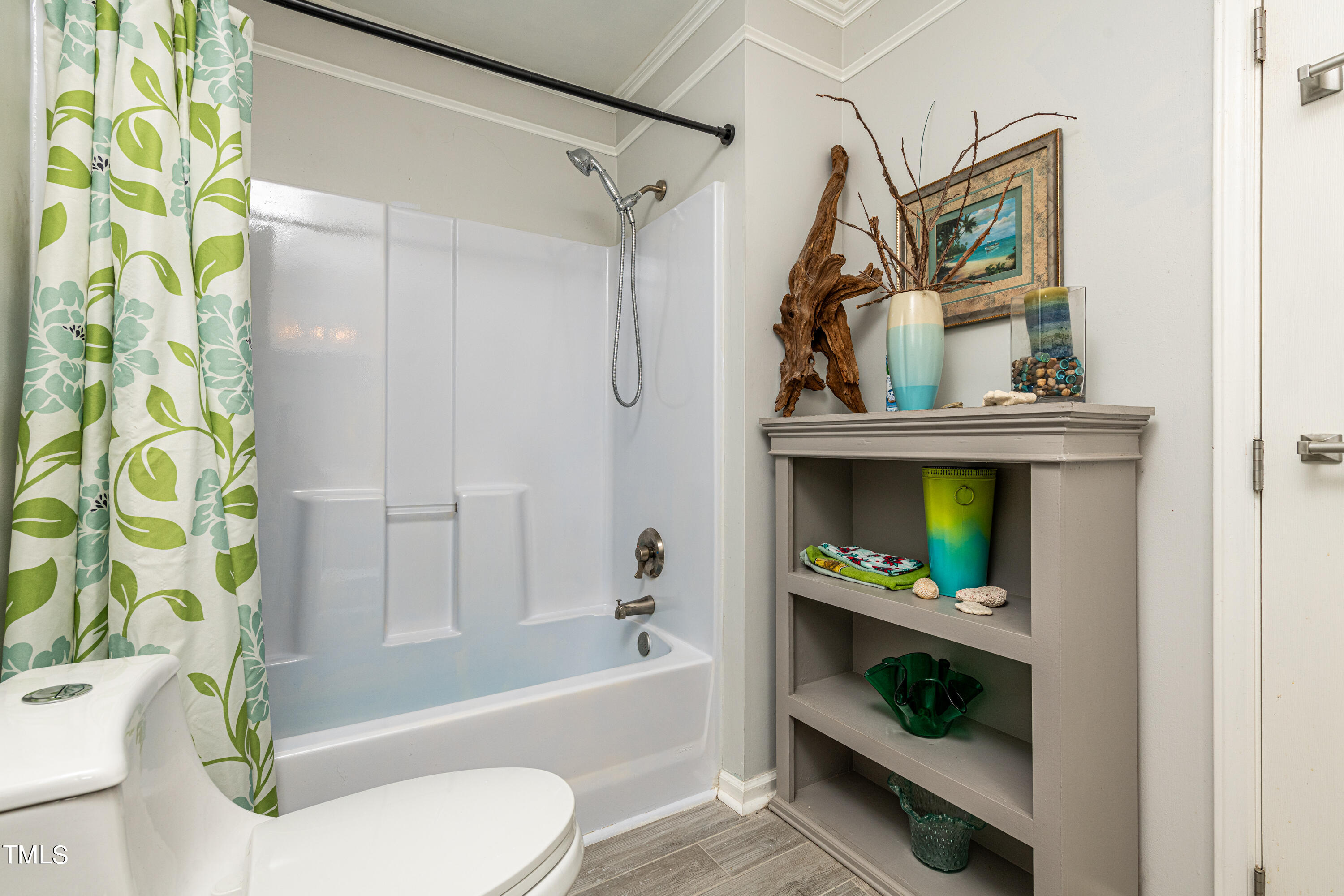 3105 Twatchman Drive Raleigh, NC 27616 - Photo 31 of 38 a bathroom with a sink a toilet and bathtub