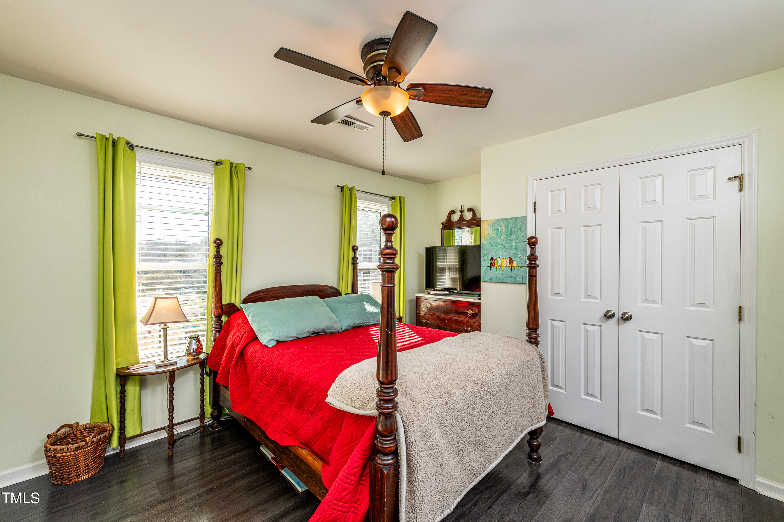 3105 Twatchman Drive Raleigh, NC 27616 - Photo 32 of 38 a bedroom with a bed and wooden floor