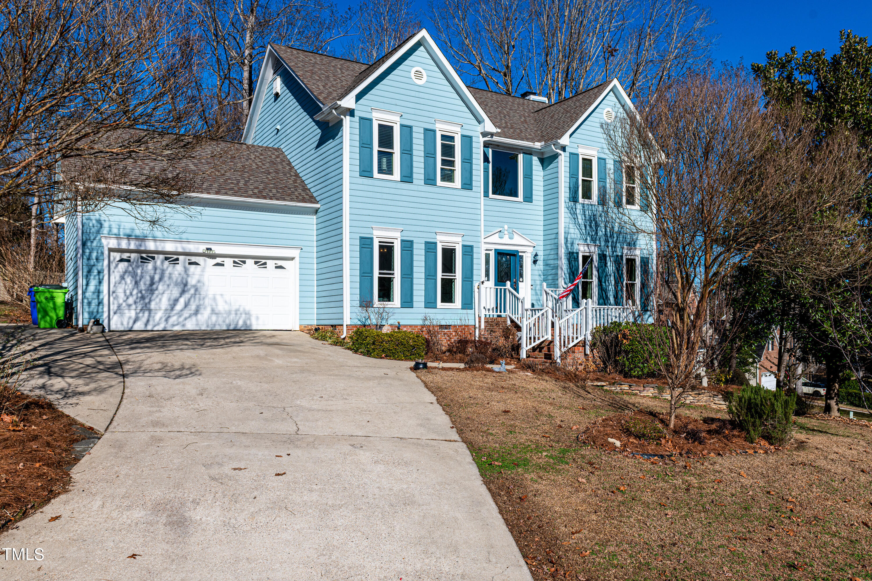 3105 Twatchman Drive Raleigh, NC 27616 - Photo 4 of 38 a view of a white house with a large windows next to a road