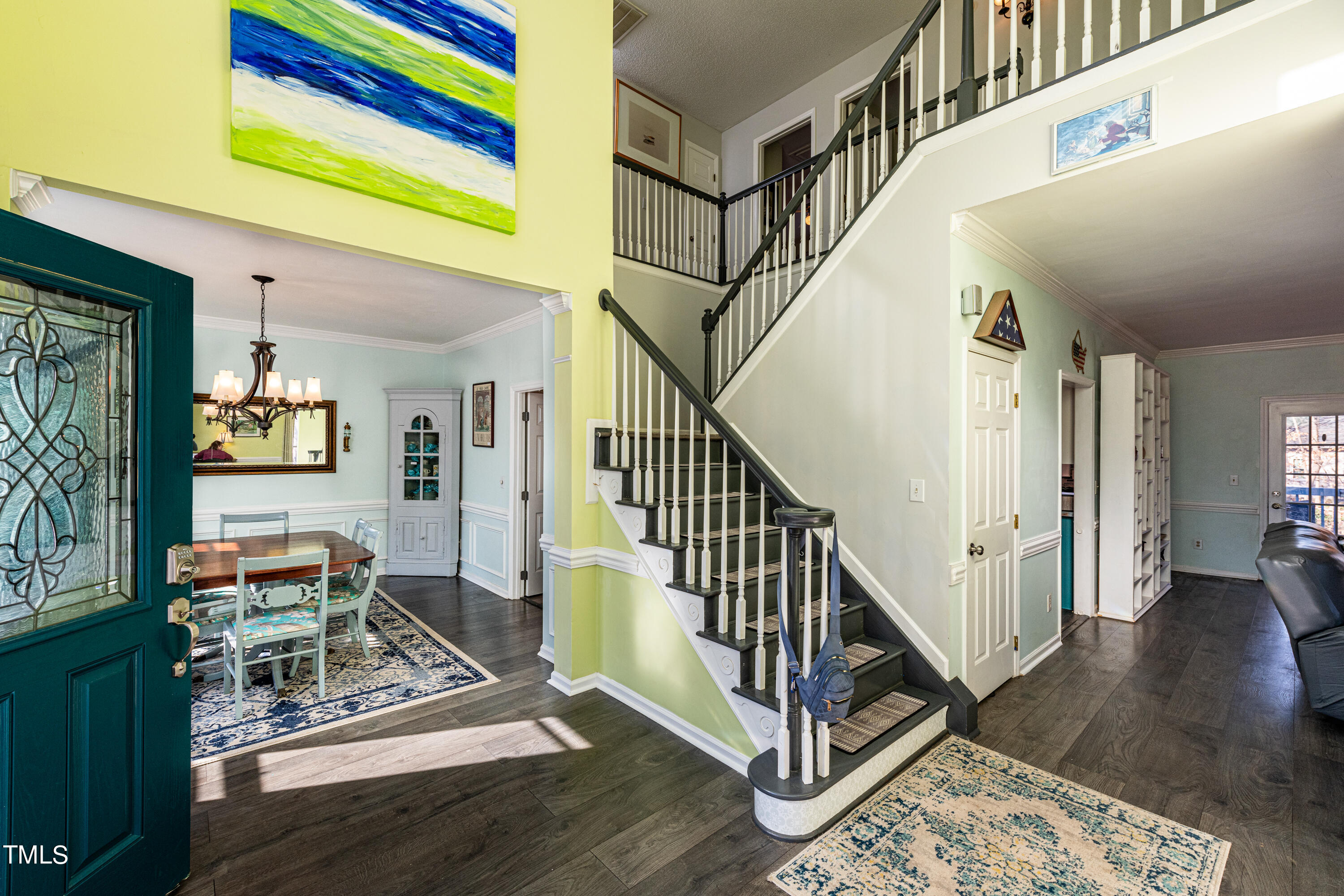 3105 Twatchman Drive Raleigh, NC 27616 - Photo 6 of 38 a view of entryway dining room and hall with wooden floor