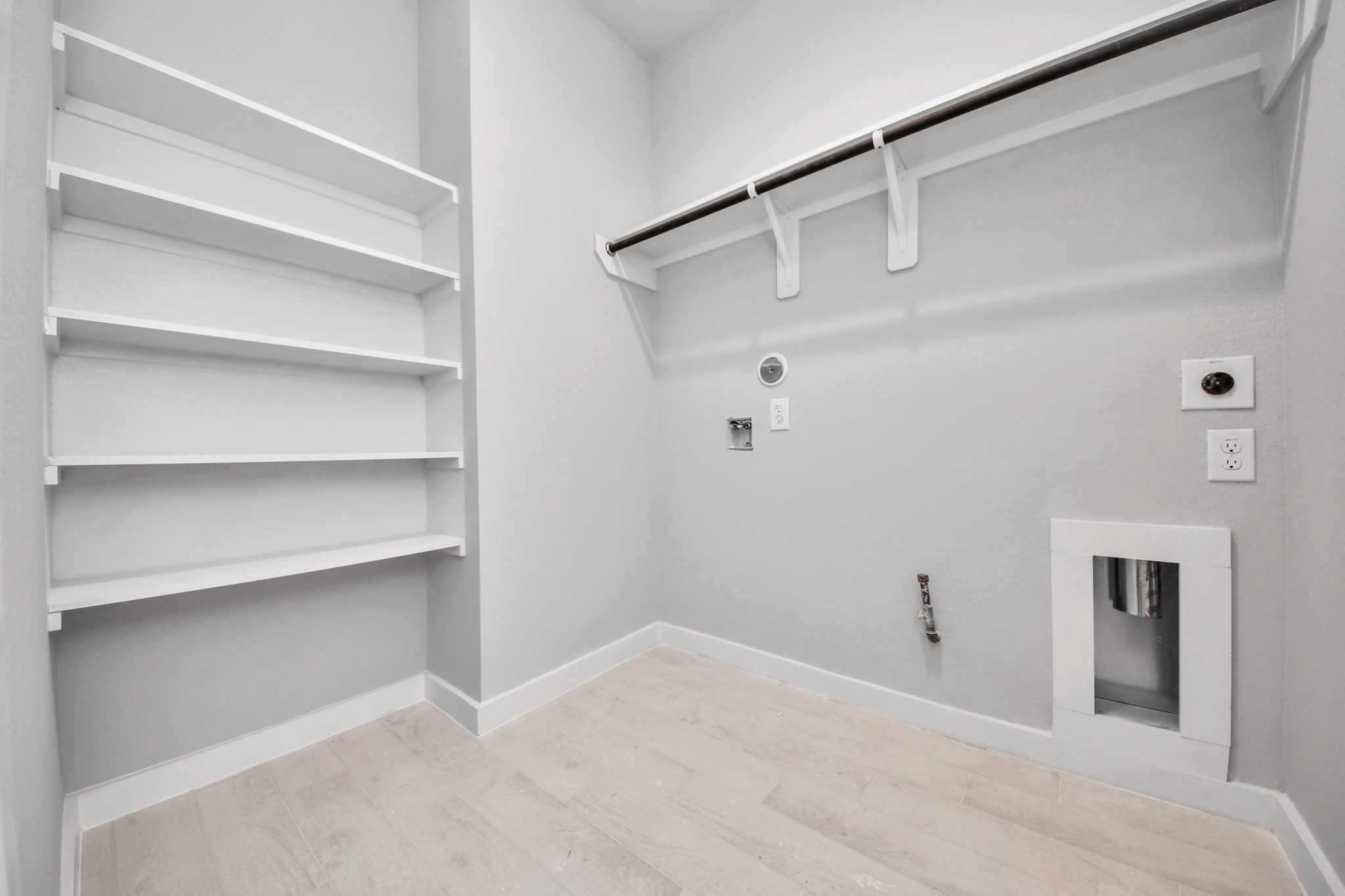2946 Burris Park Drive Spring, TX 77373 - Photo 40 of 45 A perfect blend of functionality and comfort. Capture the essence of easy living with a first-floor laundry room, thoughtfully equipped with shelving for effortless organization. Both electric and gas connections available.