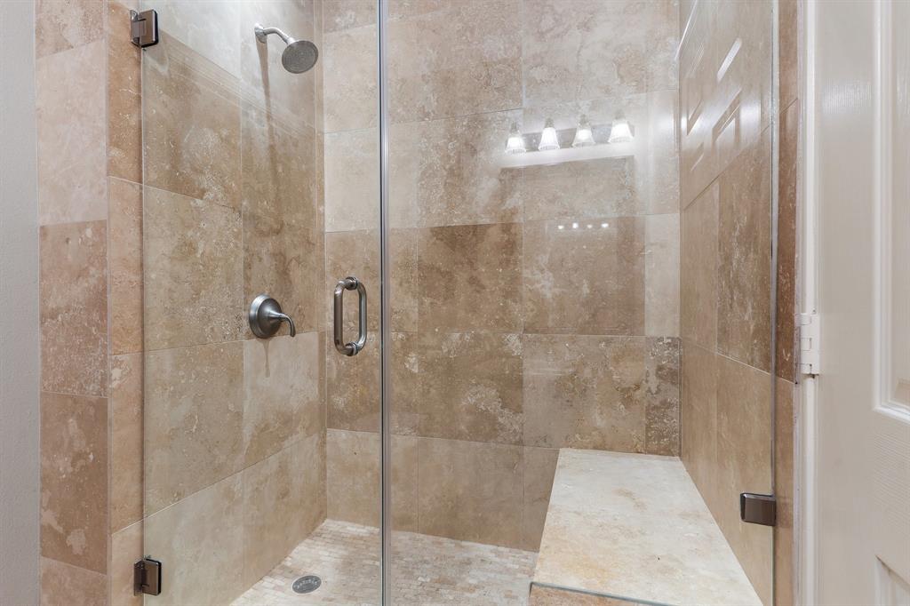 3102 Kings Road, Unit 1106 Dallas, TX 75219 - Photo 14 of 20 a bathroom with a glass shower door