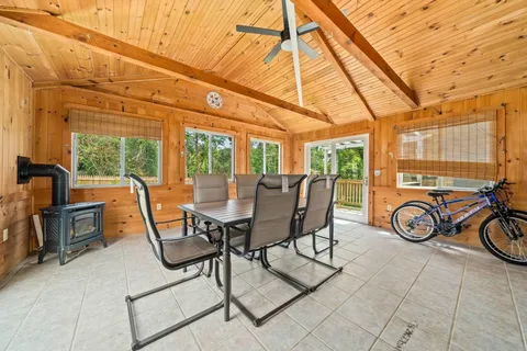 a view of a dining room with furniture window and outside view