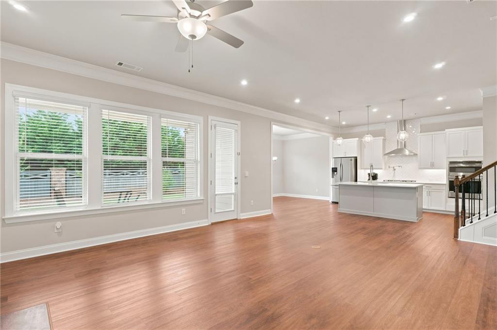 2070 Abbey Road Roswell, GA 30076 - Photo 13 of 65 a view of an empty room with a kitchen and a window