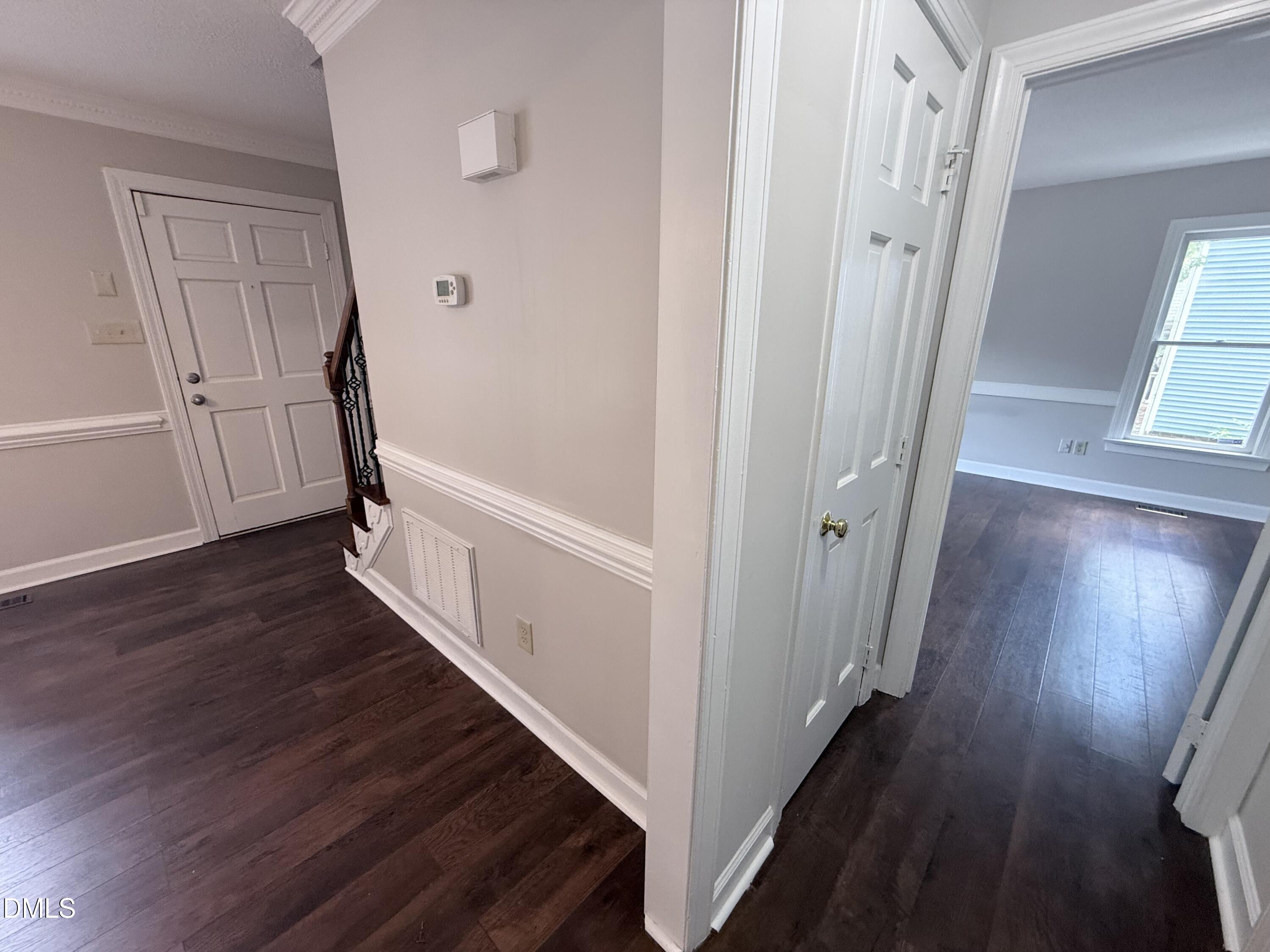 2900 Broadlands Drive Raleigh, NC 27604 - Photo 30 of 60 a view of a hallway with wooden floor and staircase