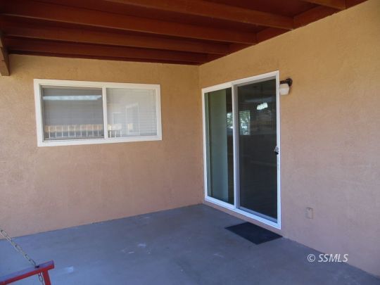 208 South Greenlawn Street Ridgecrest, CA 93555 - Photo 26 of 29 a view of an empty room with closet and a window