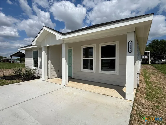 a house with trees in the background