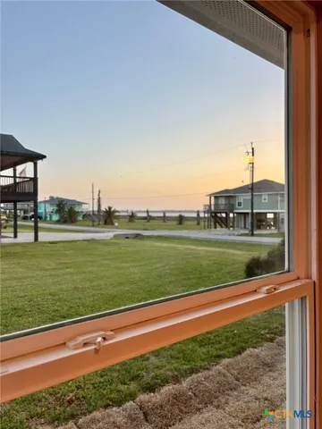 a view of a park with large trees