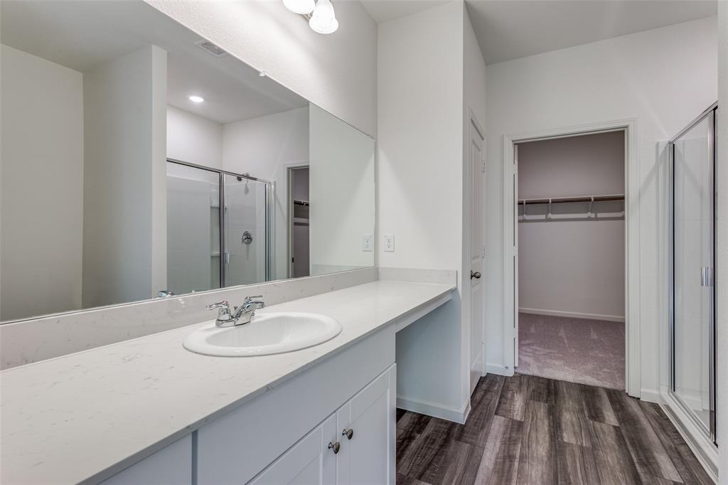 41 Glen Crossings Road Fort Worth, TX 76134 - Photo 7 of 12 a bathroom with a sink and a mirror