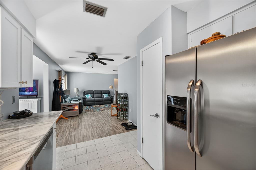 1993 Citrus Hill Road Palm Harbor, FL 34683 - Photo 21 of 37 a view of a living room and a kitchen
