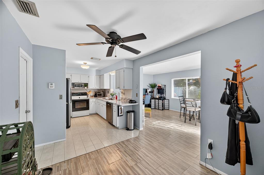 1993 Citrus Hill Road Palm Harbor, FL 34683 - Photo 23 of 37 a view of kitchen with cabinets and wooden floor