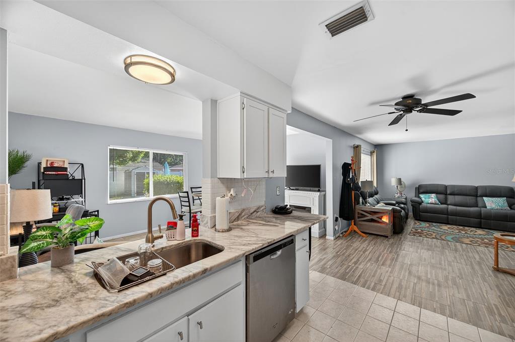 1993 Citrus Hill Road Palm Harbor, FL 34683 - Photo 25 of 37 a kitchen filled with a counter space a sink and a window
