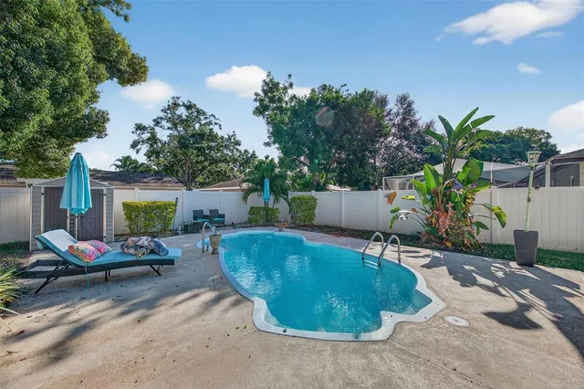 a view of a swimming pool with a patio