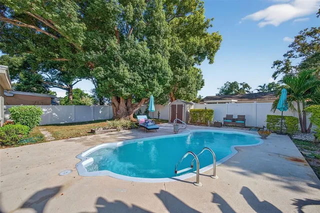 a view of a yard with a tree