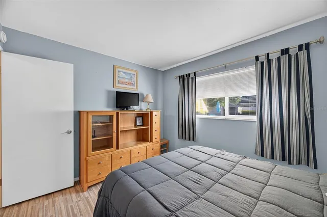 a bathroom with a sink vanity granite toilet and shower