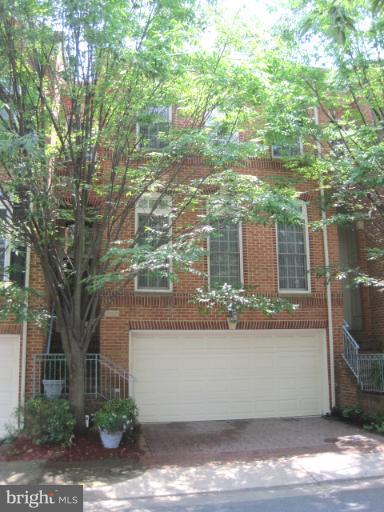 a view of a house with a tree