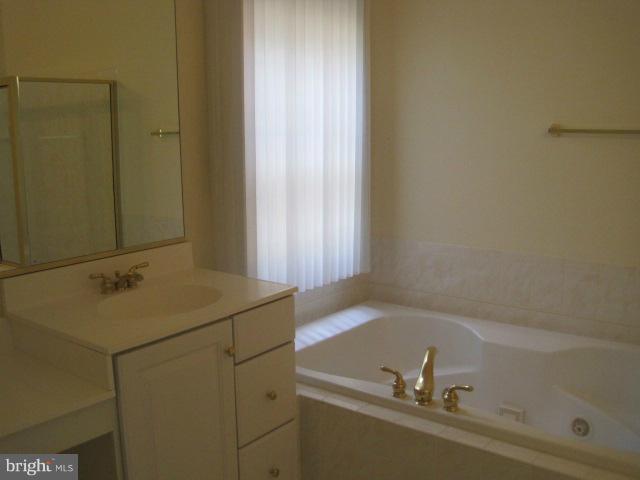 4908 Waple Lane Alexandria, VA 22304 - Photo 13 of 23 a bathroom with a sink and mirror