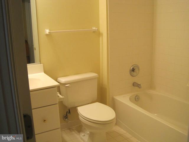 4908 Waple Lane Alexandria, VA 22304 - Photo 22 of 23 a white toilet sitting next to a bath tub