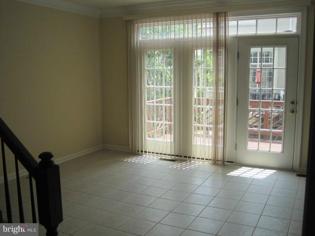 4908 Waple Lane Alexandria, VA 22304 - Photo 7 of 23 a view of an empty room with a fireplace and a large window