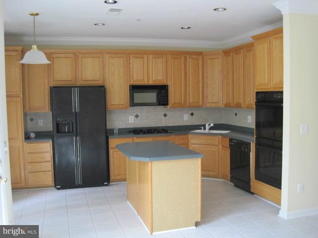 4908 Waple Lane Alexandria, VA 22304 - Photo 9 of 23 a kitchen with stainless steel appliances granite countertop a refrigerator a sink and a stove