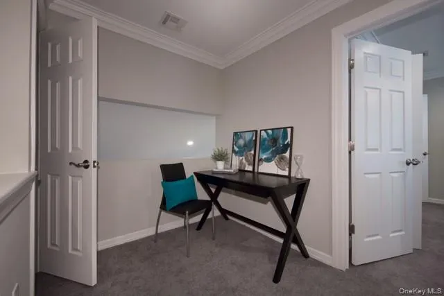 a view of a workspace with furniture