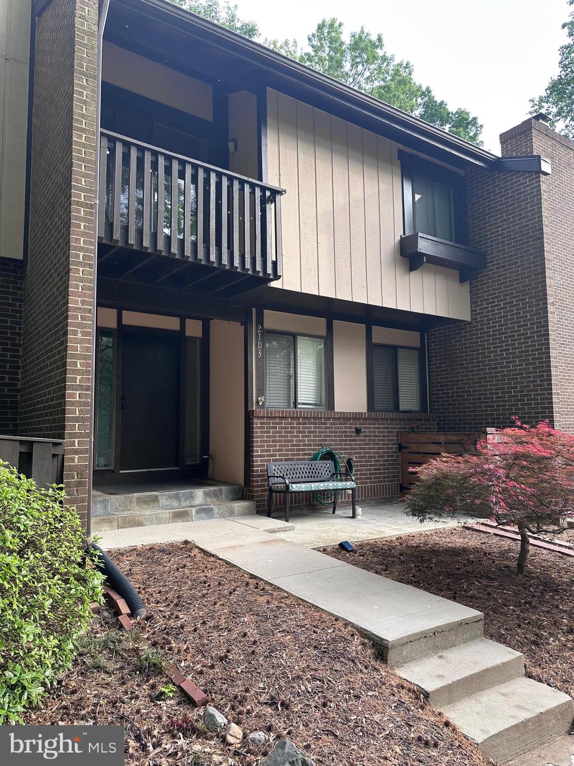 a front view of a house with yard