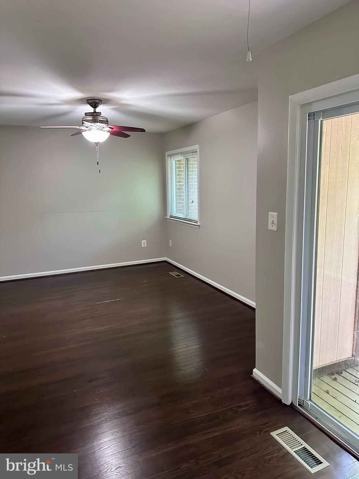 2103 Glencourse Lane Reston, VA 20191 - Photo 12 of 17 an empty room with wooden floor and windows