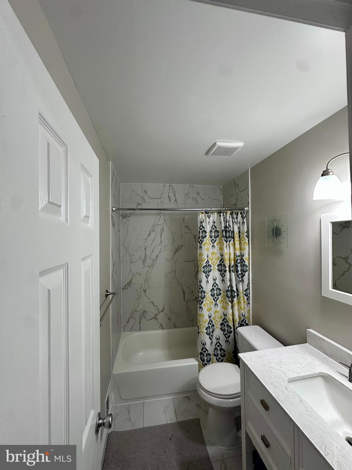 2103 Glencourse Lane Reston, VA 20191 - Photo 13 of 17 a bathroom with a sink a toilet and shower