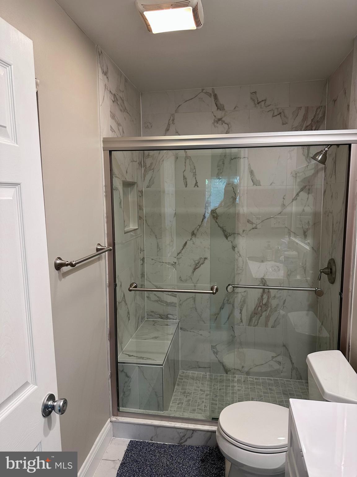 2103 Glencourse Lane Reston, VA 20191 - Photo 15 of 17 a bathroom with a toilet and a shower