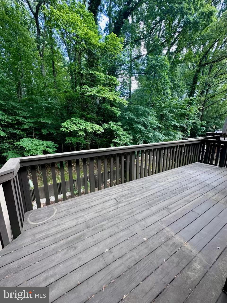 2103 Glencourse Lane Reston, VA 20191 - Photo 16 of 17 a balcony with wooden floor and fence