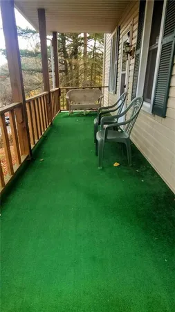 a view of an chairs in the backyard