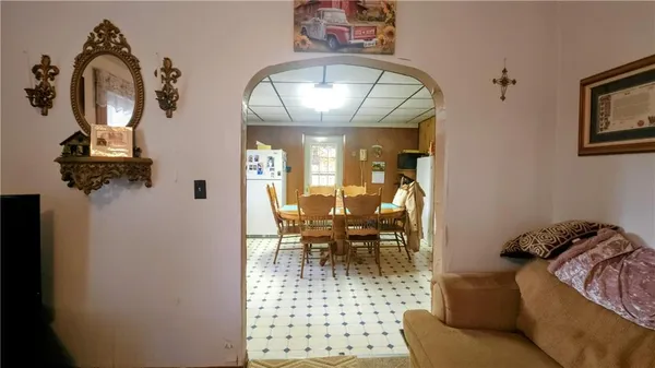 a view of a livingroom with furniture and a mirror