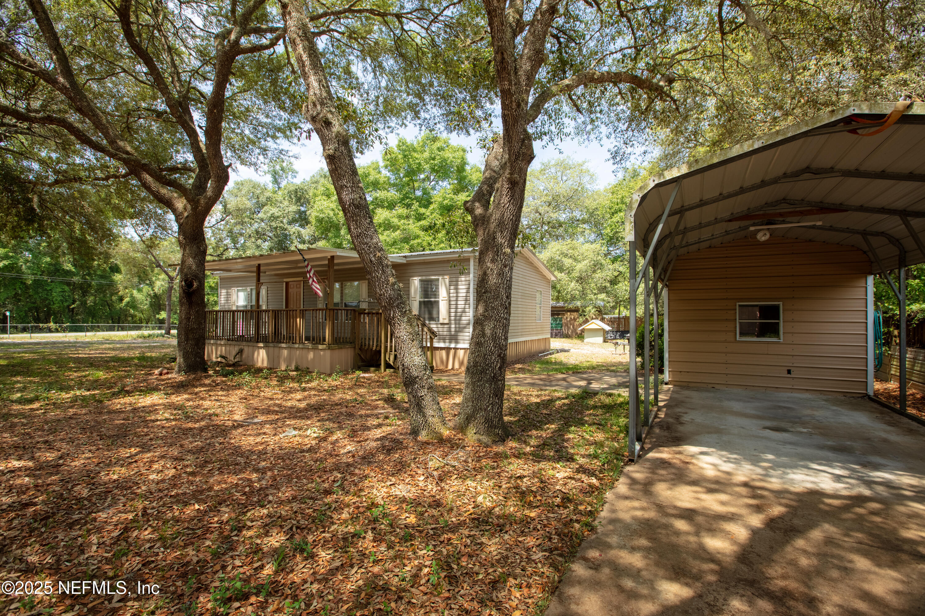 8186 County Line Road Melrose, FL 32666 - Photo 1 of 42 a view of a house with a yard