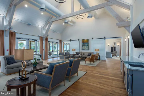a living room with fireplace furniture and a flat screen tv