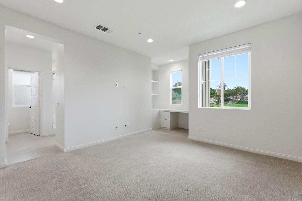 2711 Jujube Street Spring Valley, CA 91977 - Photo 13 of 31 an empty room with windows and closet